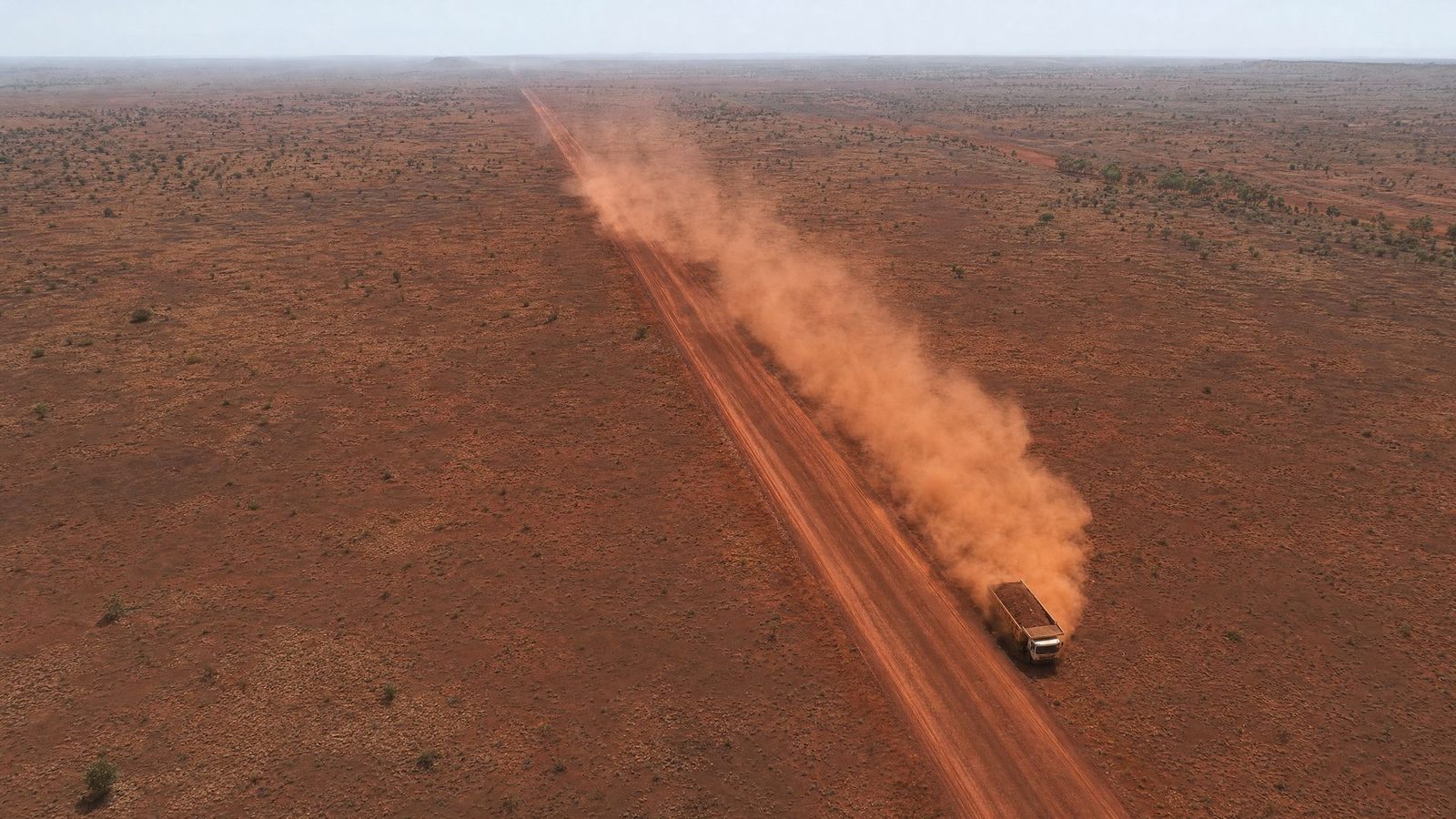 Aerial: dust plume over a haul road